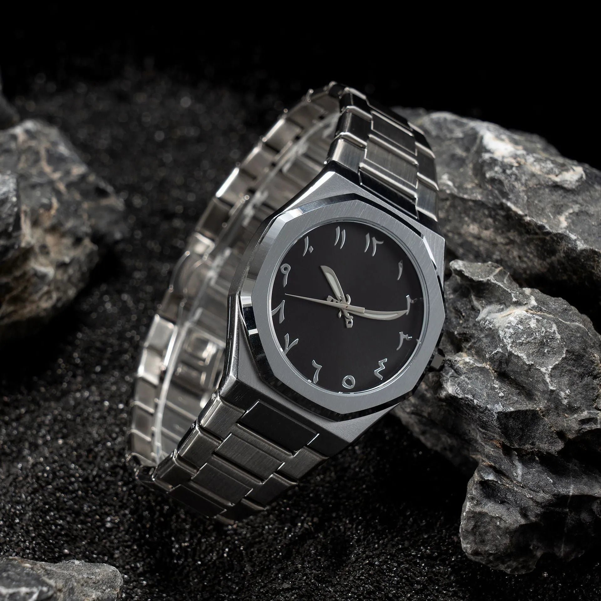Business casual men's quartz watch with a steel belt on a wrist, showing dial colour options of black, black with silver scale, or silver with black accents.