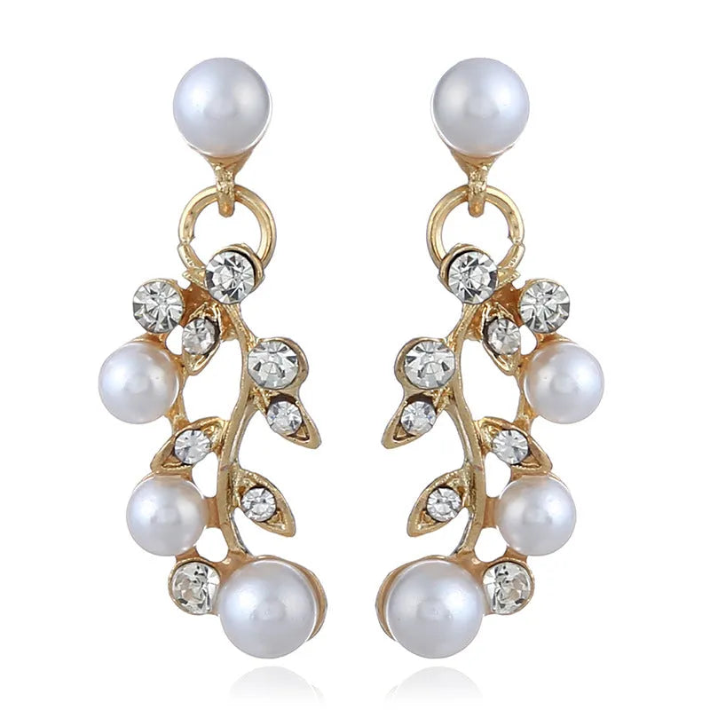 Pearl diamond earring and necklace bride set in gold finish on white background