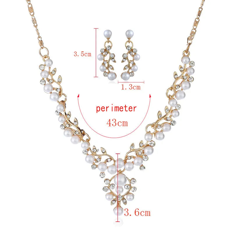 Pearl diamond earring and necklace bride set in gold finish on white background