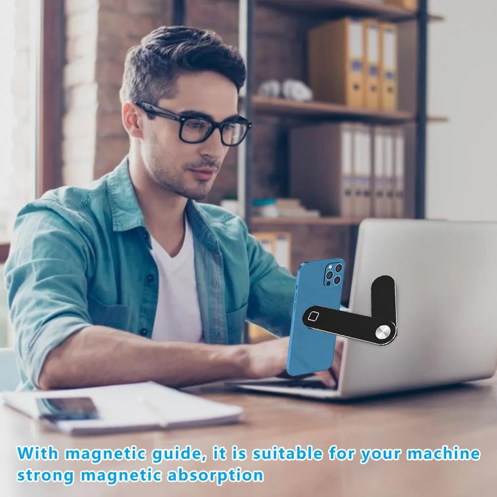 Black aluminium laptop phone holder clipped to side of monitor with smartphone attached.