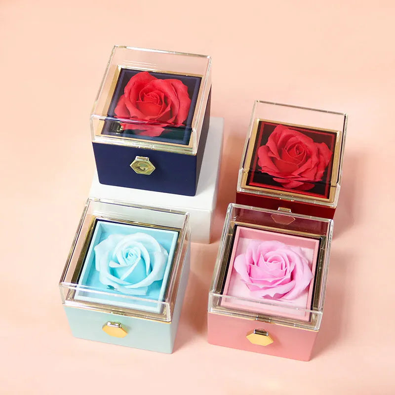 Rotating drawer jewellery gift box with preserved red rose under clear acrylic dome.