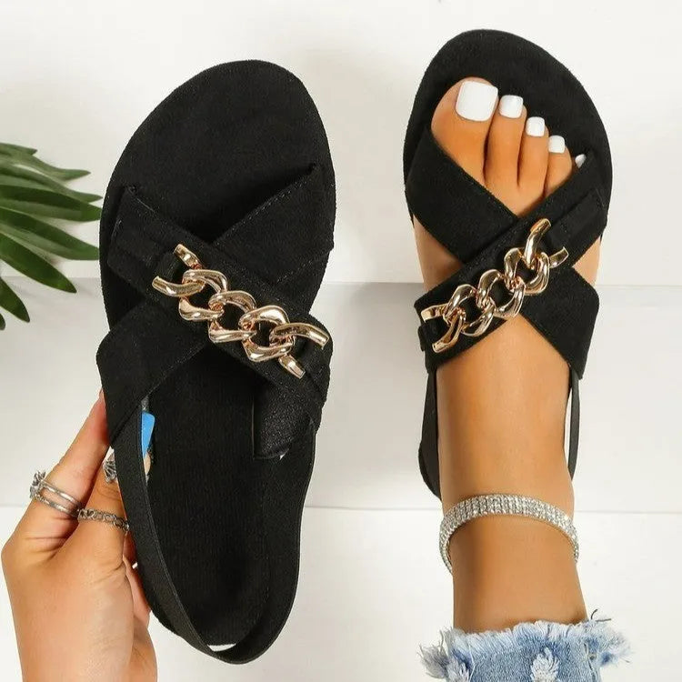 Chains sandals in black with elasticated open toe slide design, rubber sole, and metal detail on PU upper