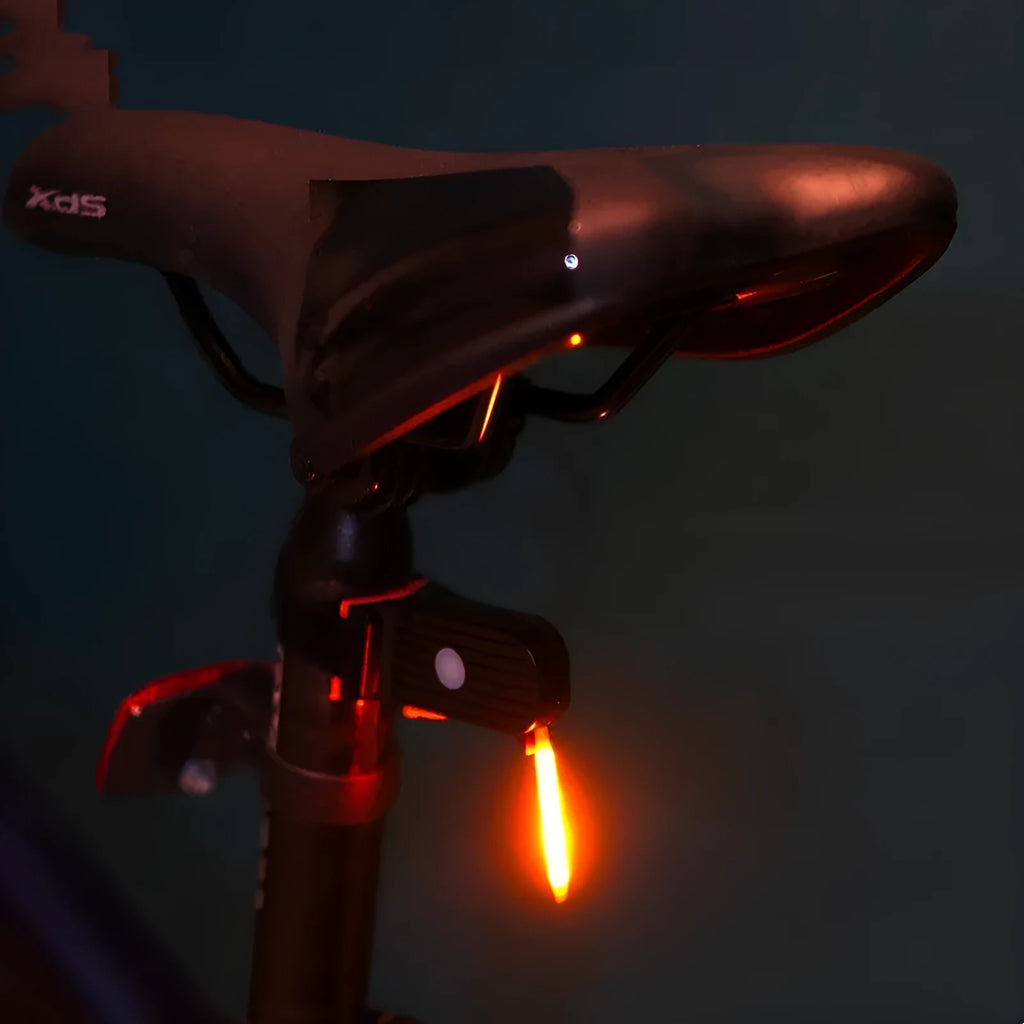 USB-charging waterproof bicycle taillight for night riding shown in blue, pink, red, white and yellow colour options.