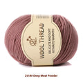 Roll of hand-knitting wool thread in various colours for scarf and sweater projects.