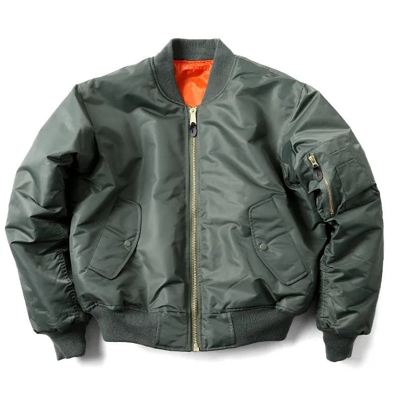 Man wearing a loose-fit army green nylon pilot jacket with a double-sided, wear-resistant construction.