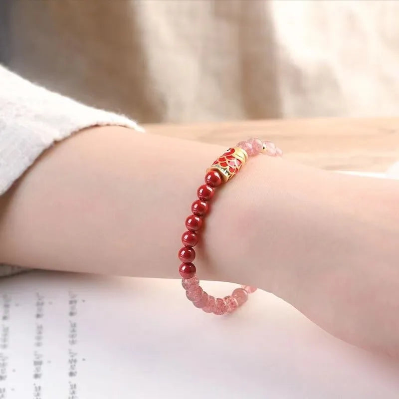 Purple cinnabar and strawberry quartz women's bracelet with lucky koi peach blossom charm