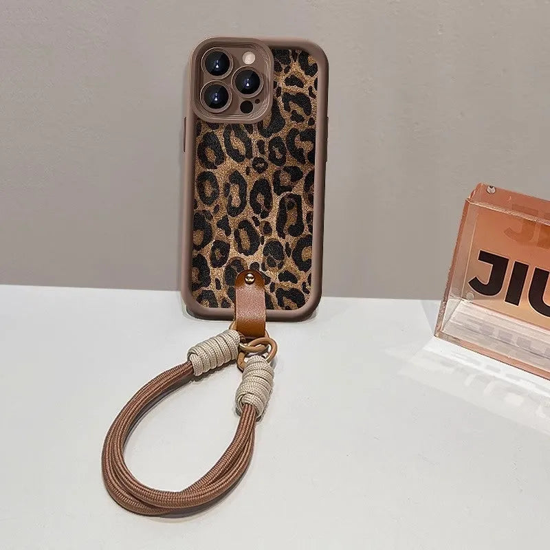 Brown leopard print silicone lanyard case for iPhone with hands-free strap.