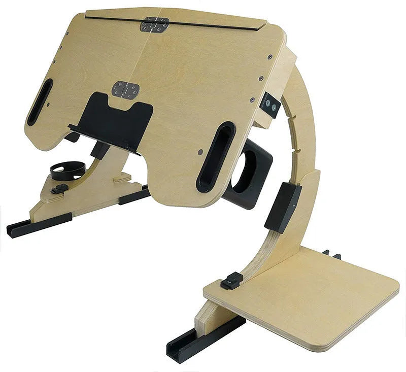 White maple wooden folding bed desk with adjustable tilted surface, holding a laptop on a duvet.