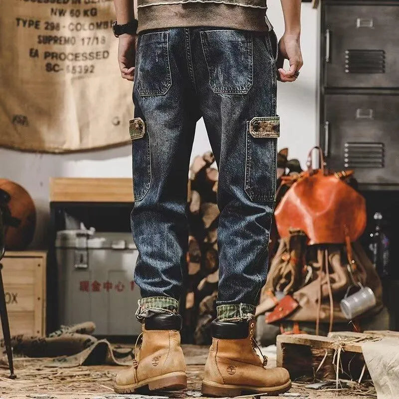 Men's loose blue denim cargo jeans with heavy distressed finish, mid waist, button fly