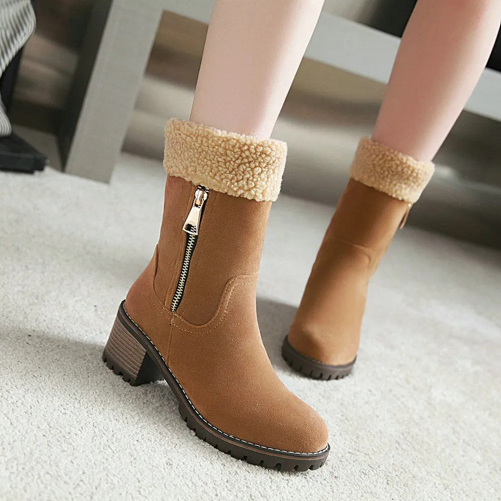 Unisex black snow boots with a rubber sole and plush lining on a white background.