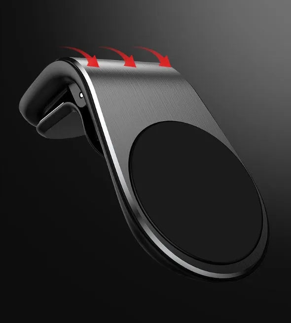 Car phone bracket mounted on vehicle air vent in silver finish showing rotation adjustment