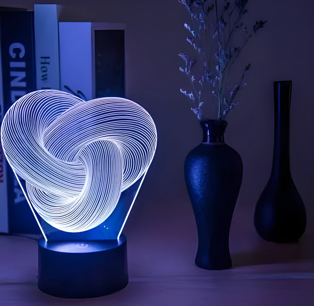 Twist abstract LED 3D night light in colour gradient mode on a wooden table with remote control