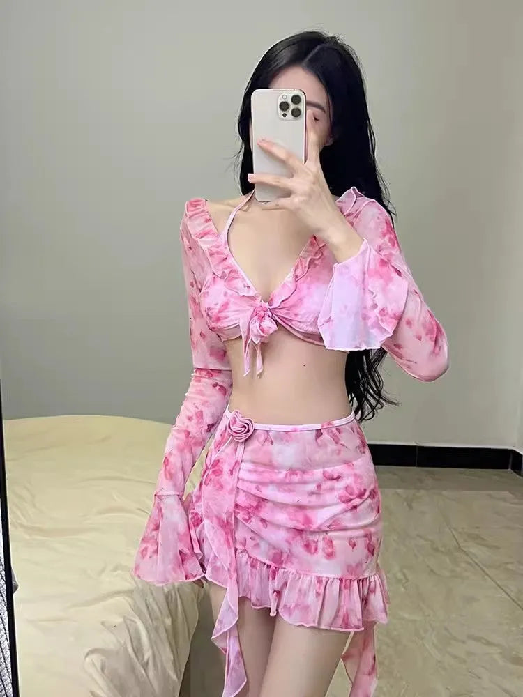 Women's cherry blossom pink floral print bikini swimsuit set on a mannequin.