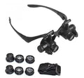 Black double eye magnifier glasses with LED lights and interchangeable lenses for precision repair work