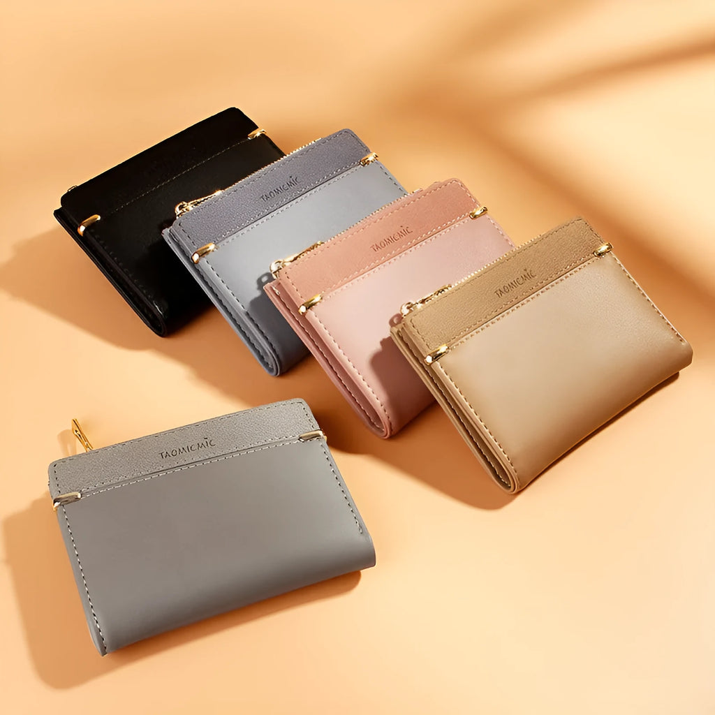 Compact black PU leather ladies wallet open to show card slots, bill compartment, change slot, and zippered section.