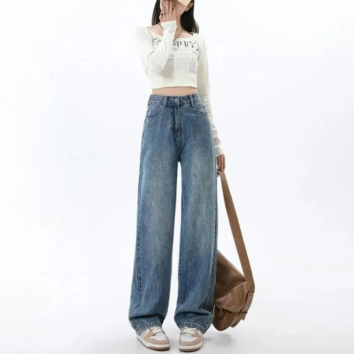 Women's retro blue high-waist wide-leg denim jeans on a hanger, showing the straight leg cut and front pockets.