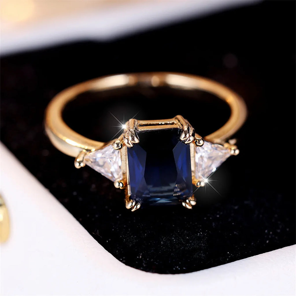 Copper rectangular fashion ring for women in gold sapphire blue colour