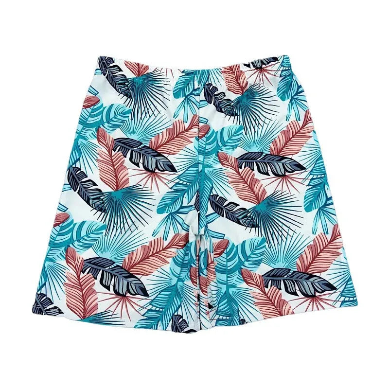 Men's cropped swimming trunks in a blue leaf pattern, made from polyester and spandex blend.