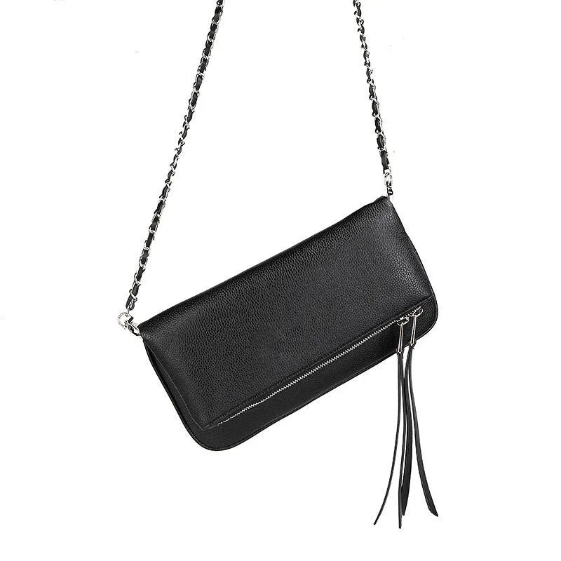 Women's black chain clutch bag with detachable shoulder strap showing interior zipper pocket and gold hardware details