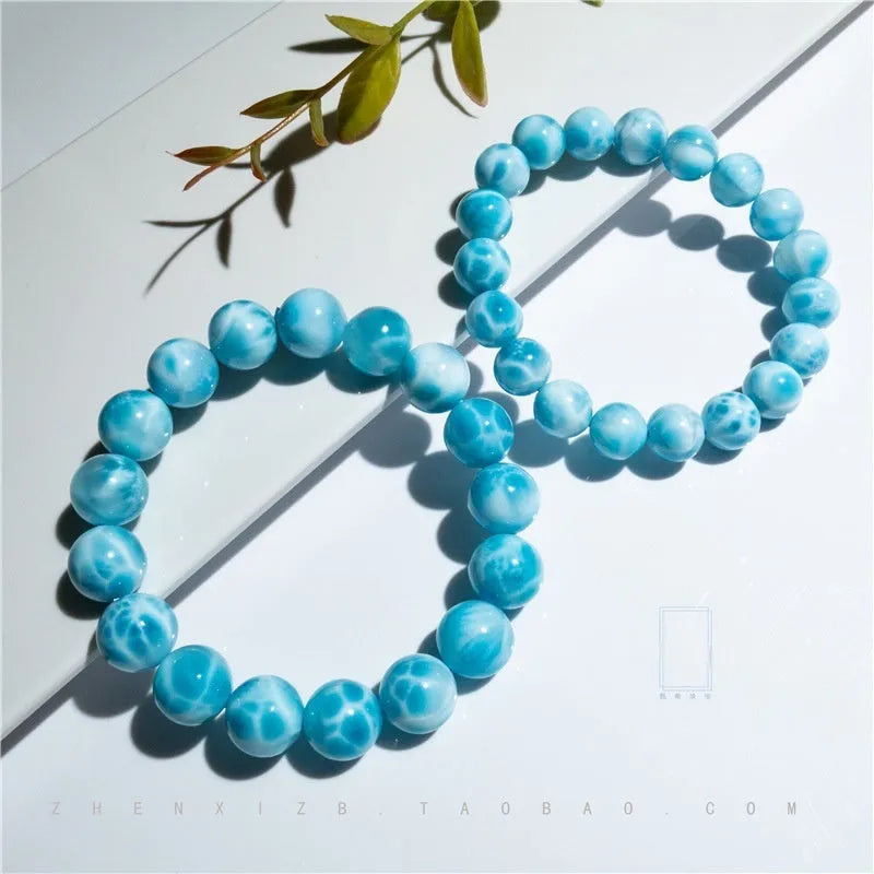 Blue manually crafted Bodhi bracelet with sea-pattern crystal stones and pearl details.