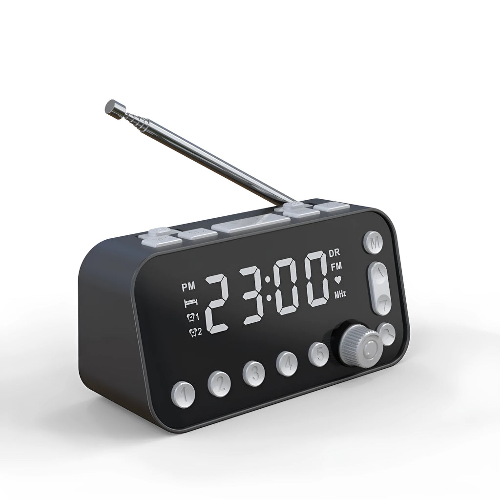 Black DAB bedside alarm clock with large LED display, pig tail antenna, and USB ports on a wooden table.