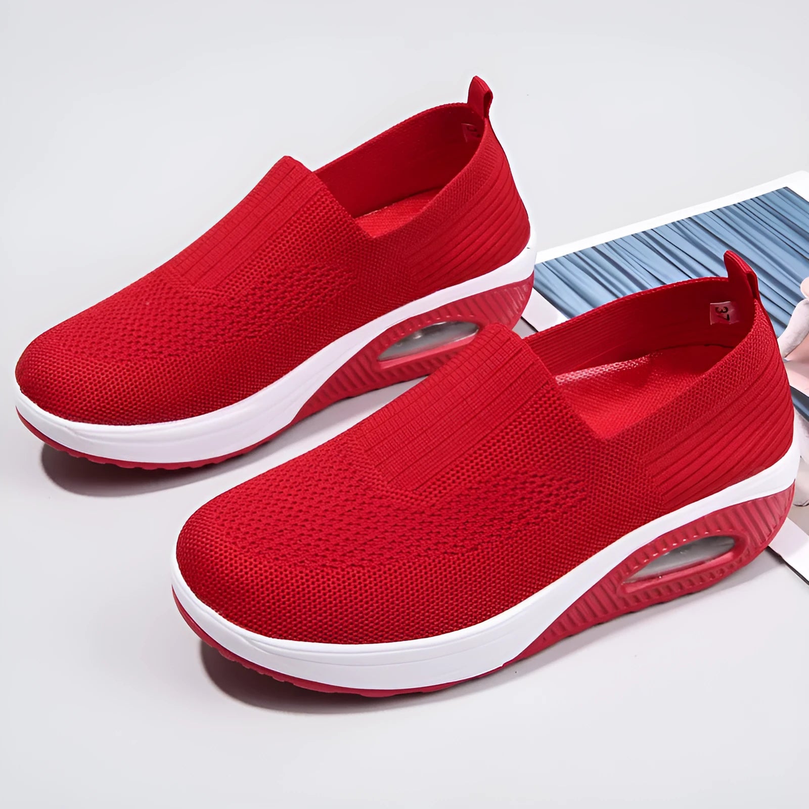 Women's black mesh running shoes with round toe and mid heel on a white background