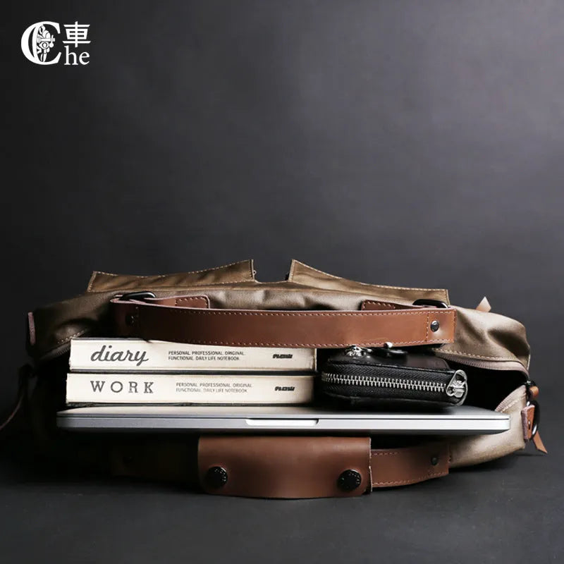 Dpark black 14 inch laptop bag with single shoulder strap showing padded compartment and organisation pockets
