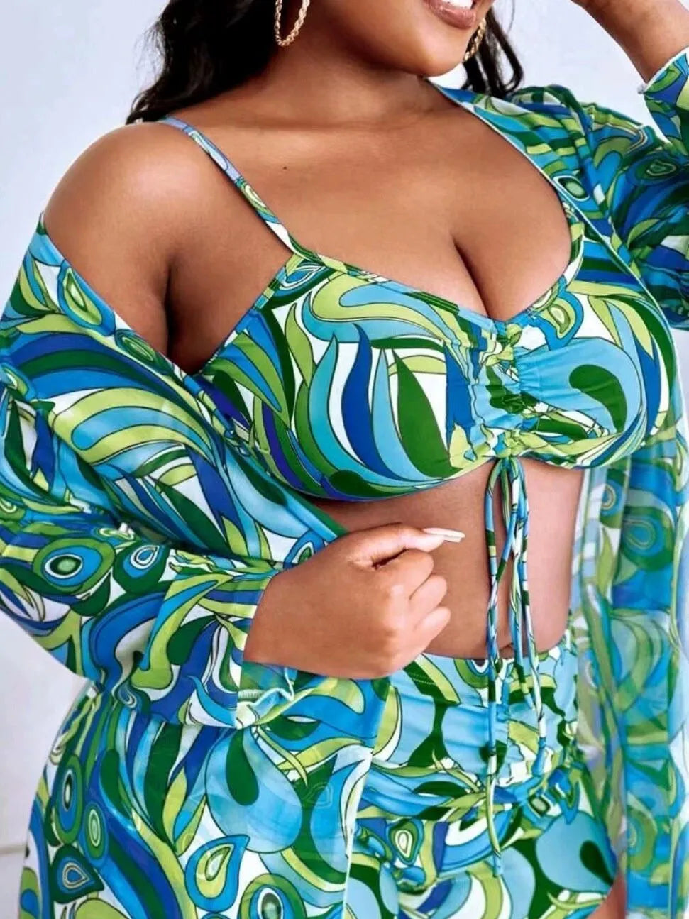 Women's floral print bikini set with underwire bra, high-waisted briefs, and a sheer cover-up cardigan.
