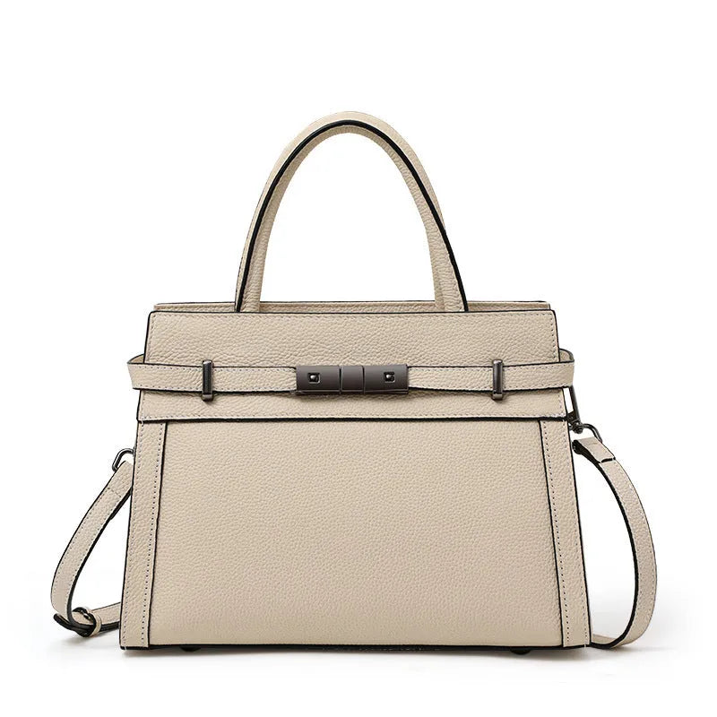 Genuine leather women's crossbody bag in clamshell design with multiple internal pockets