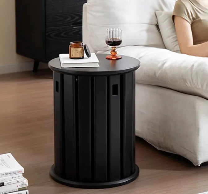 Modern round iron dining stool with stackable design in a wood-tone finish.