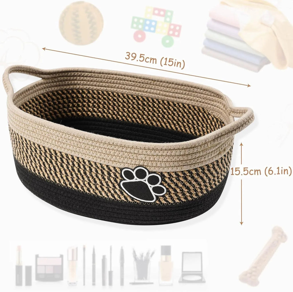Light beige handmade woven cotton rope storage basket with a wooden handle on a wooden floor.