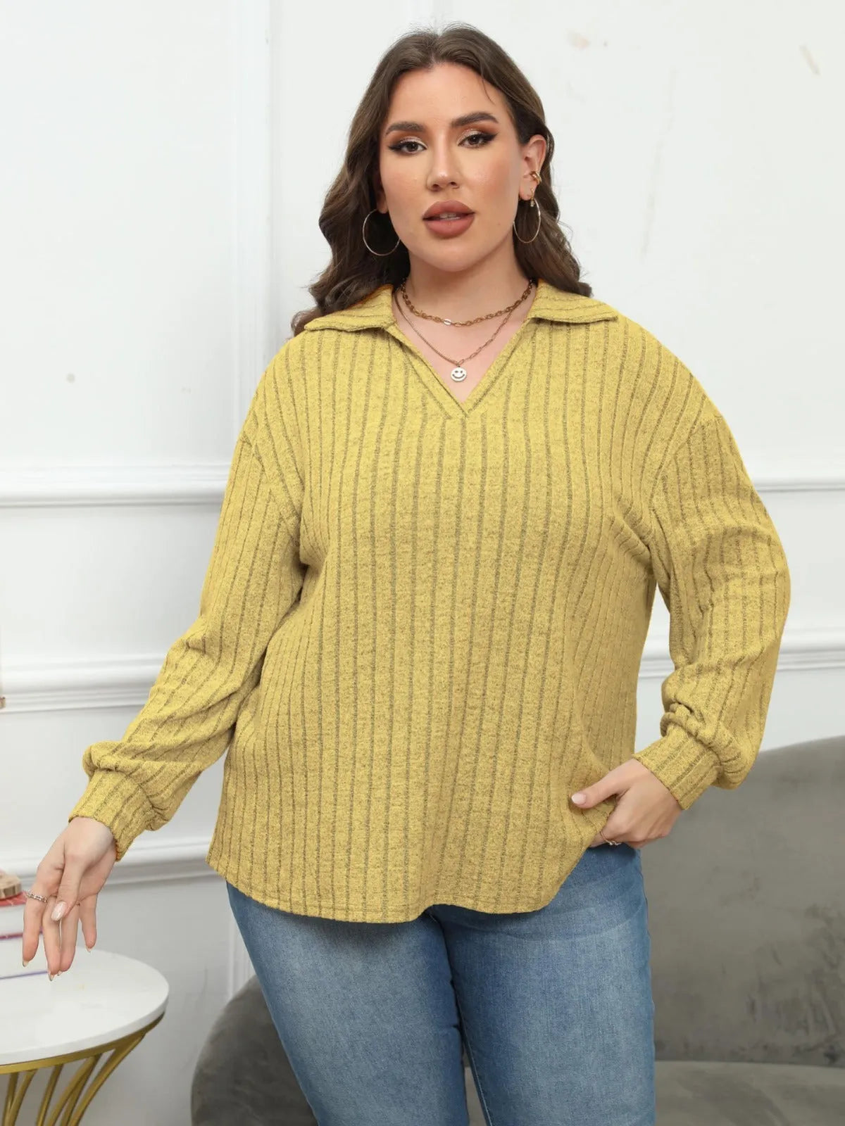 Women's plus size grey polo collar blouse with lantern sleeves made from polar fleece fabric.