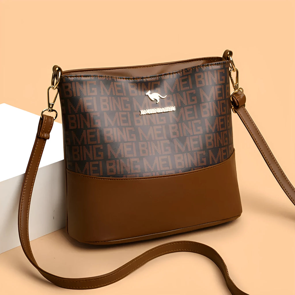 Brown retro messenger bag with soft leather texture showing interior phone and file compartments