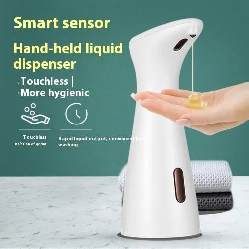 White infrared sensor automatic soap dispenser on a bathroom sink