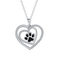 Women's copper dog paw print heart necklace on a cross chain.