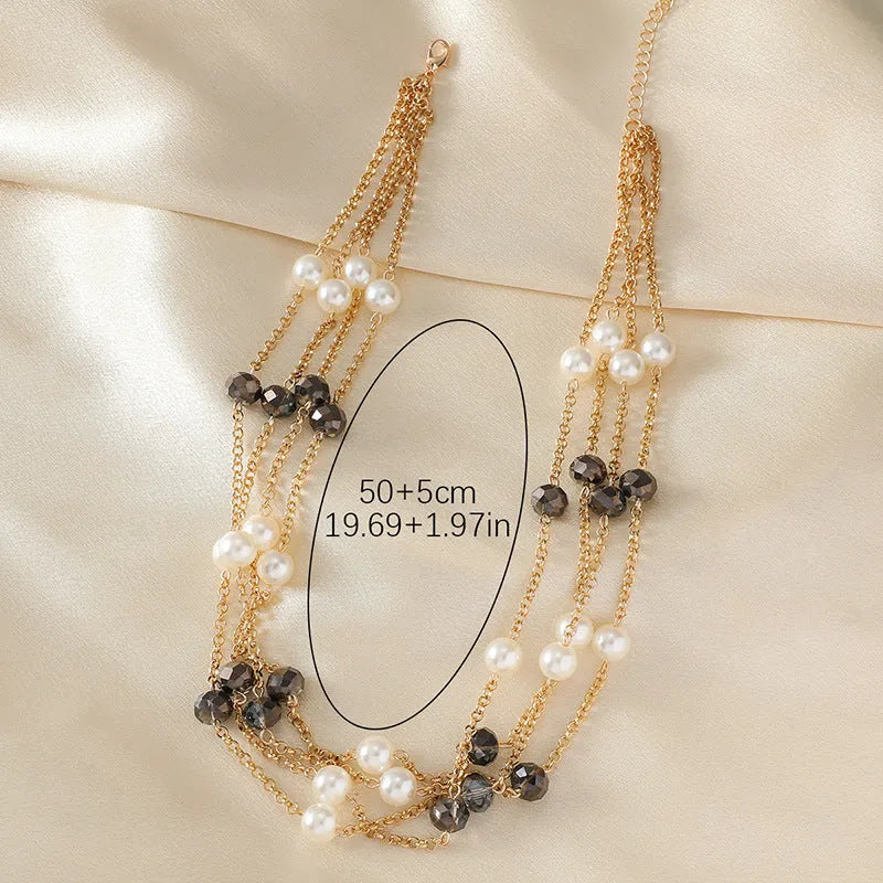 Women's sweater necklace with pearl crystal chain and round geometric alloy pendant in multiple colour options