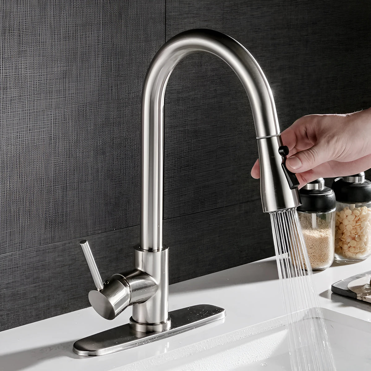 Pull-out hot and cold kitchen faucet with brushed copper finish and single lever lift on a kitchen sink