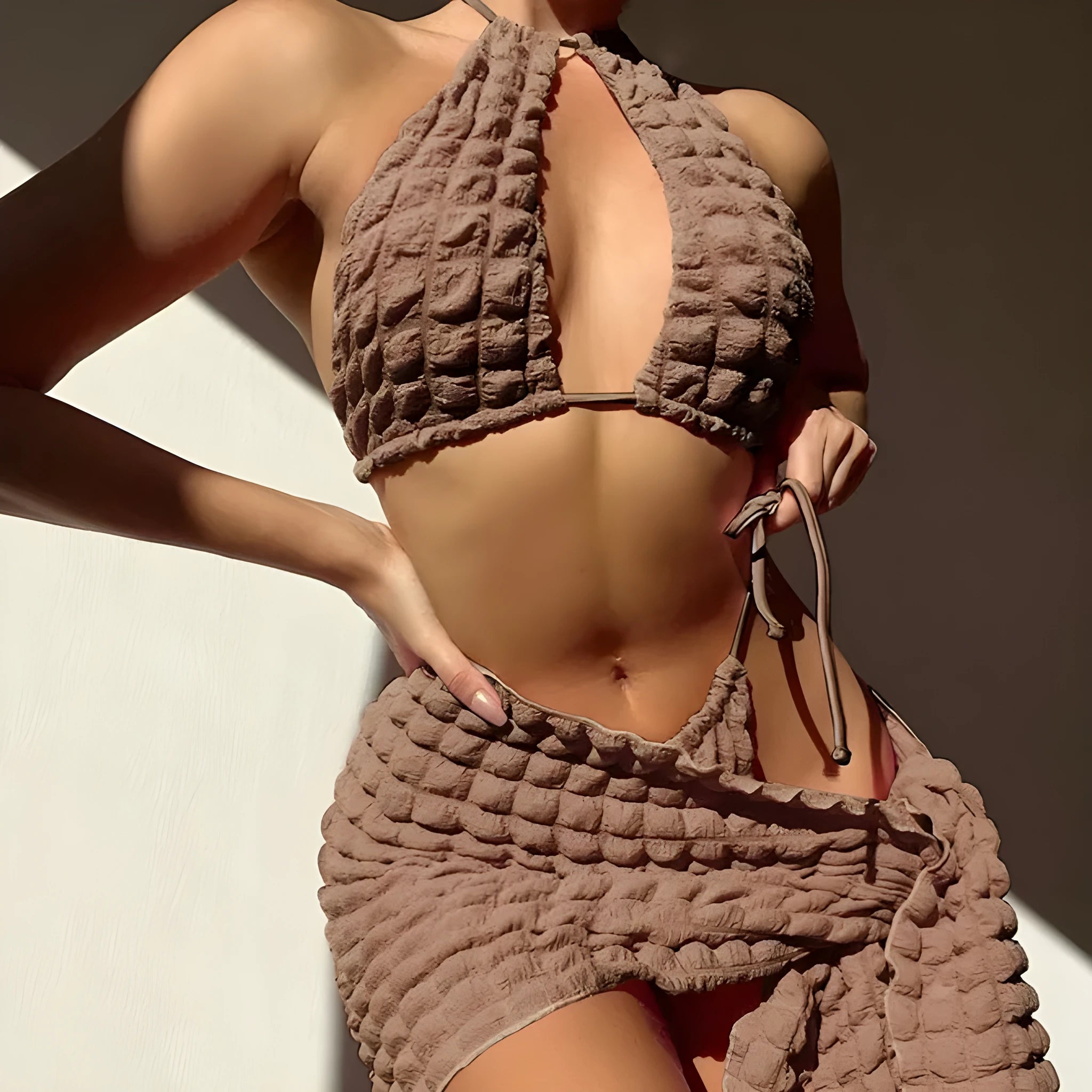 Brown seersucker lace-up three-piece women's bikini swimsuit set on a mannequin
