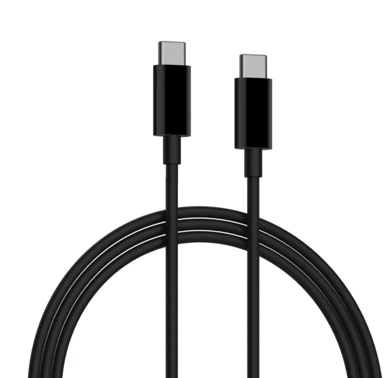 Black ZMI USB-C 65W notebook power adapter showing compact size next to a USB-C cable.