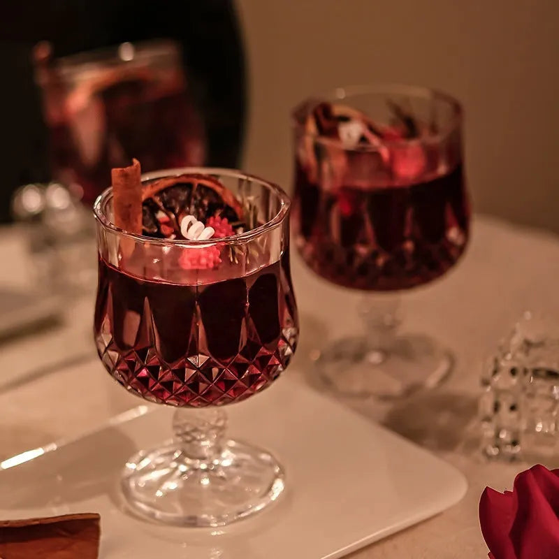Scented candle in a glass wine goblet with translucent jelly crystal wax and French mulled wine label.