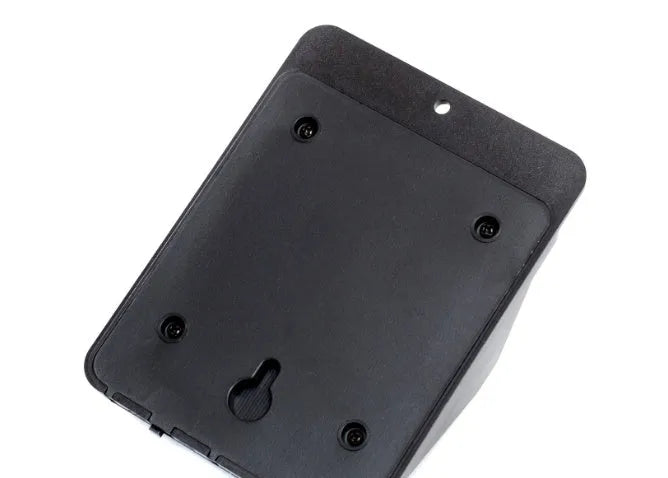 Set of four white square solar-powered LED security lights with motion sensor mounted on a brick wall