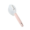 Stainless steel fruit peeler with pink PP plastic handle on a light background