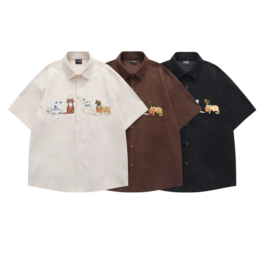 Loose cardigan shirt with embroidered cartoon pattern in apricot, brown, and black colours