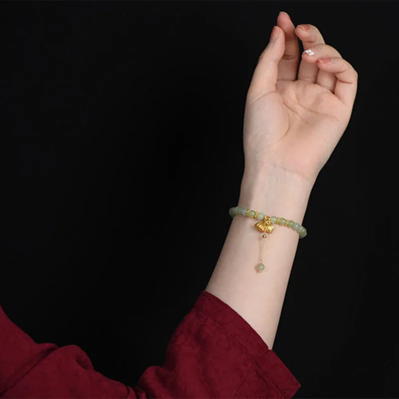 Natural Hetian Jade bracelet with lotus design and sunny water patterns