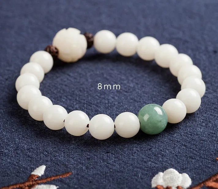 Natural white jade Bodhi bracelet with round beads and transfer bead on white background
