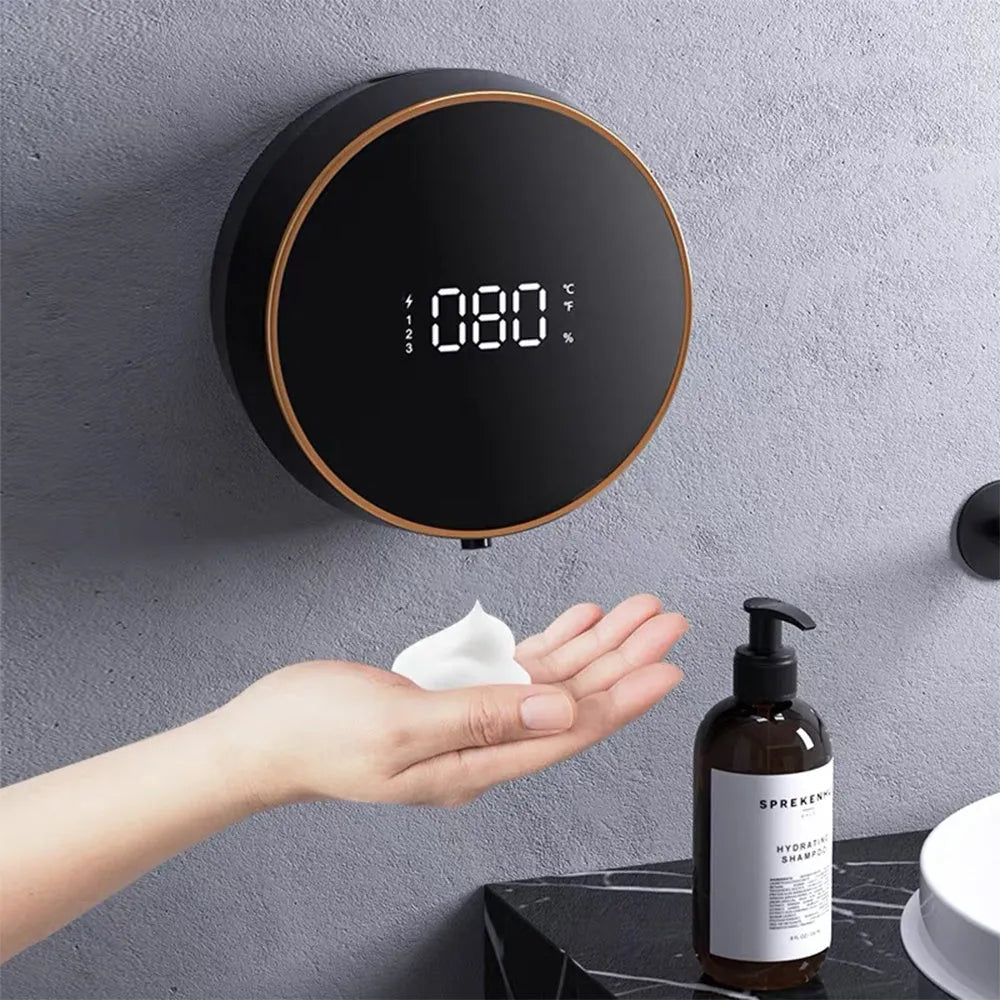 Black and white automatic sensor foam soap dispenser mounted on a wall with USB charging port.