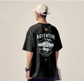 Men's black plus size loose fit short-sleeved t-shirt on a hanger