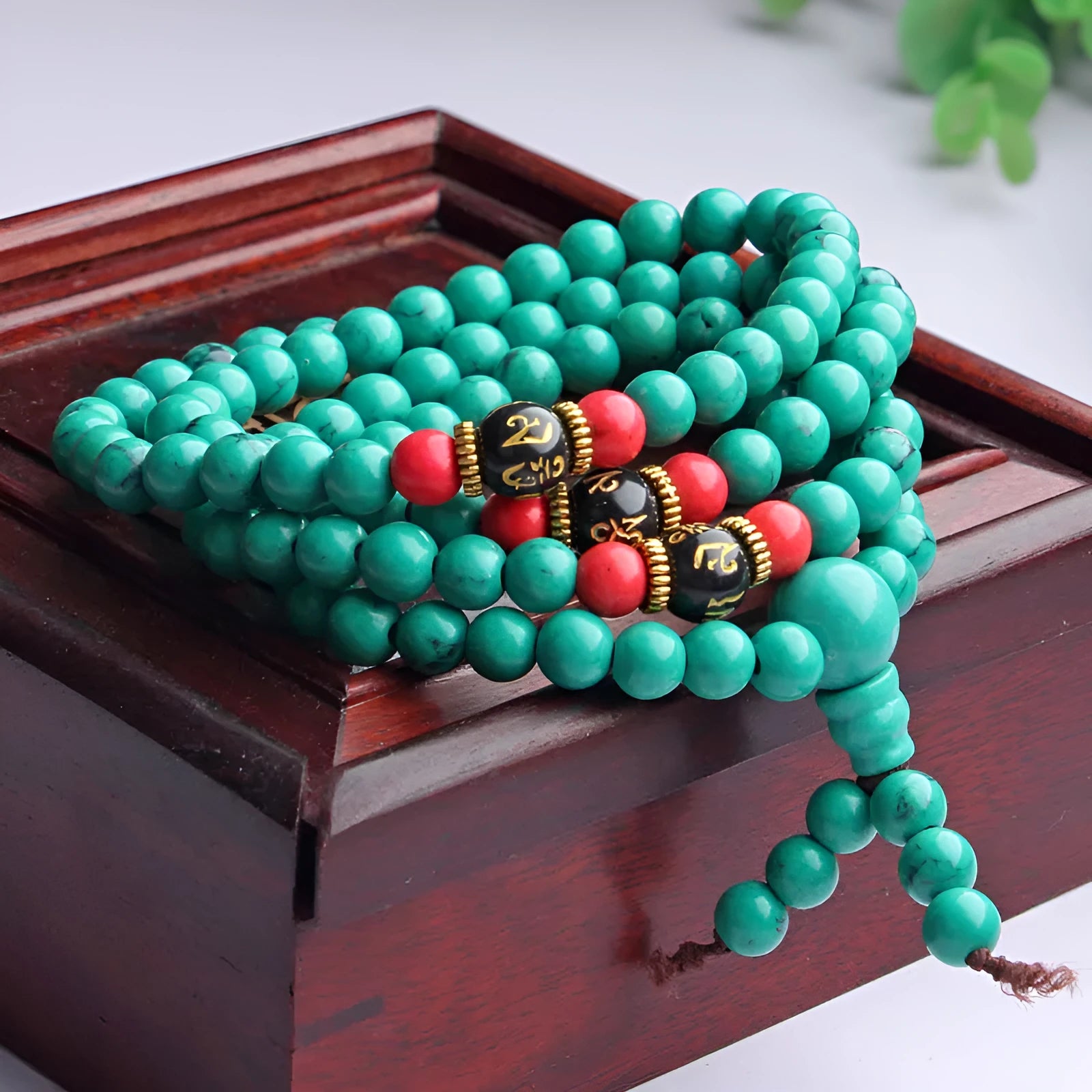 Turquoise coloured 108-bead bracelet with round synthetic stone powder beads