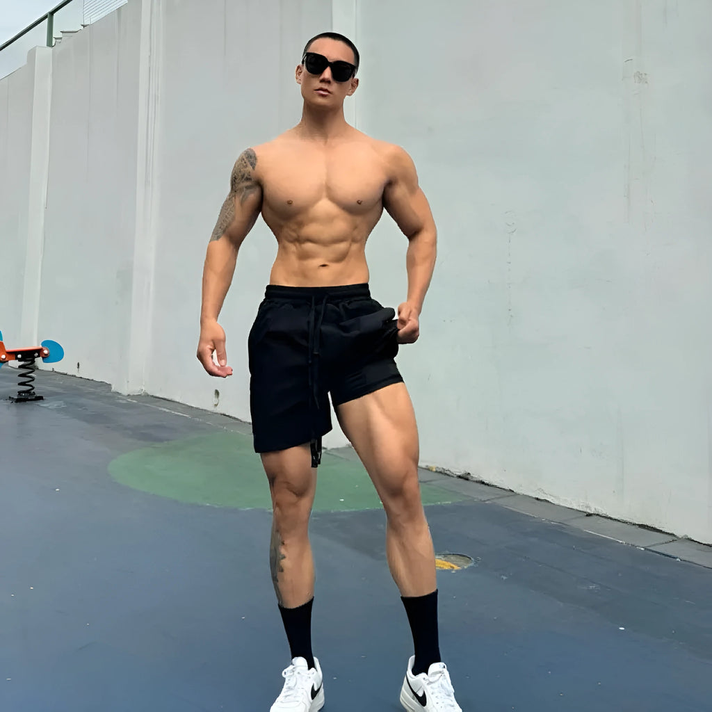 Men's ice silk nylon quarter-length shorts in light grey, laid flat to show double-layer construction.