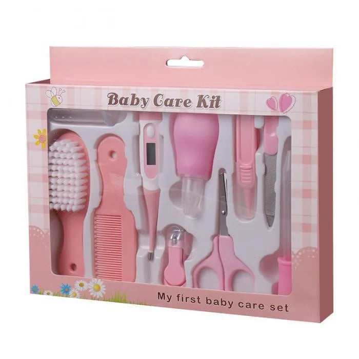 Portable baby health suit 9-piece grooming set in pink with scissors, clippers, comb and thermometer on white background